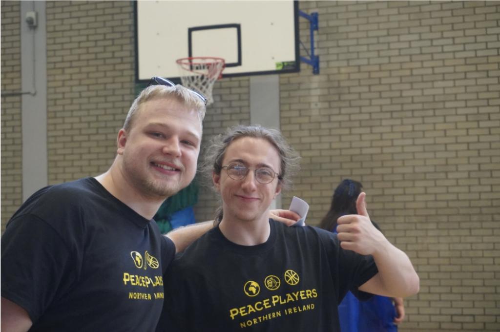 two peaceplayers participants posing for a photo